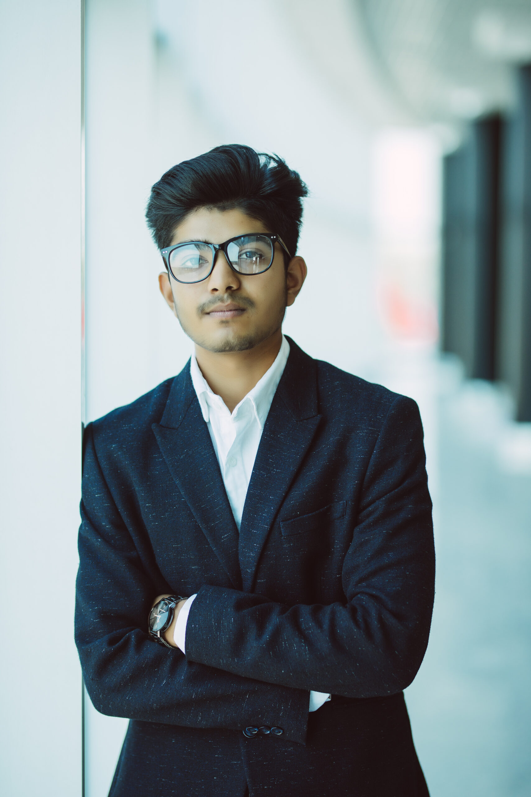 indian young businessman standing in modern office